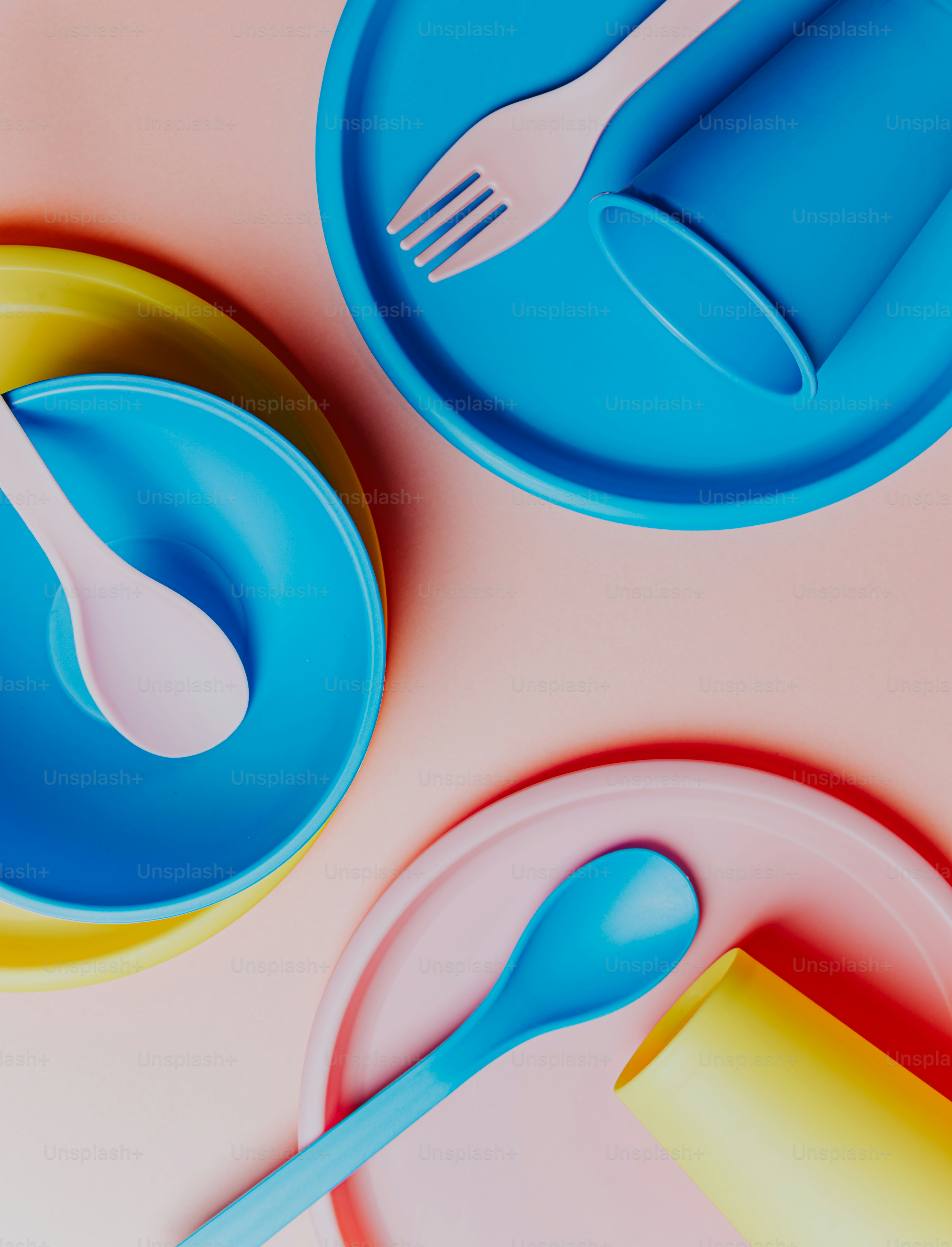 a close up of a plate with a fork and spoon