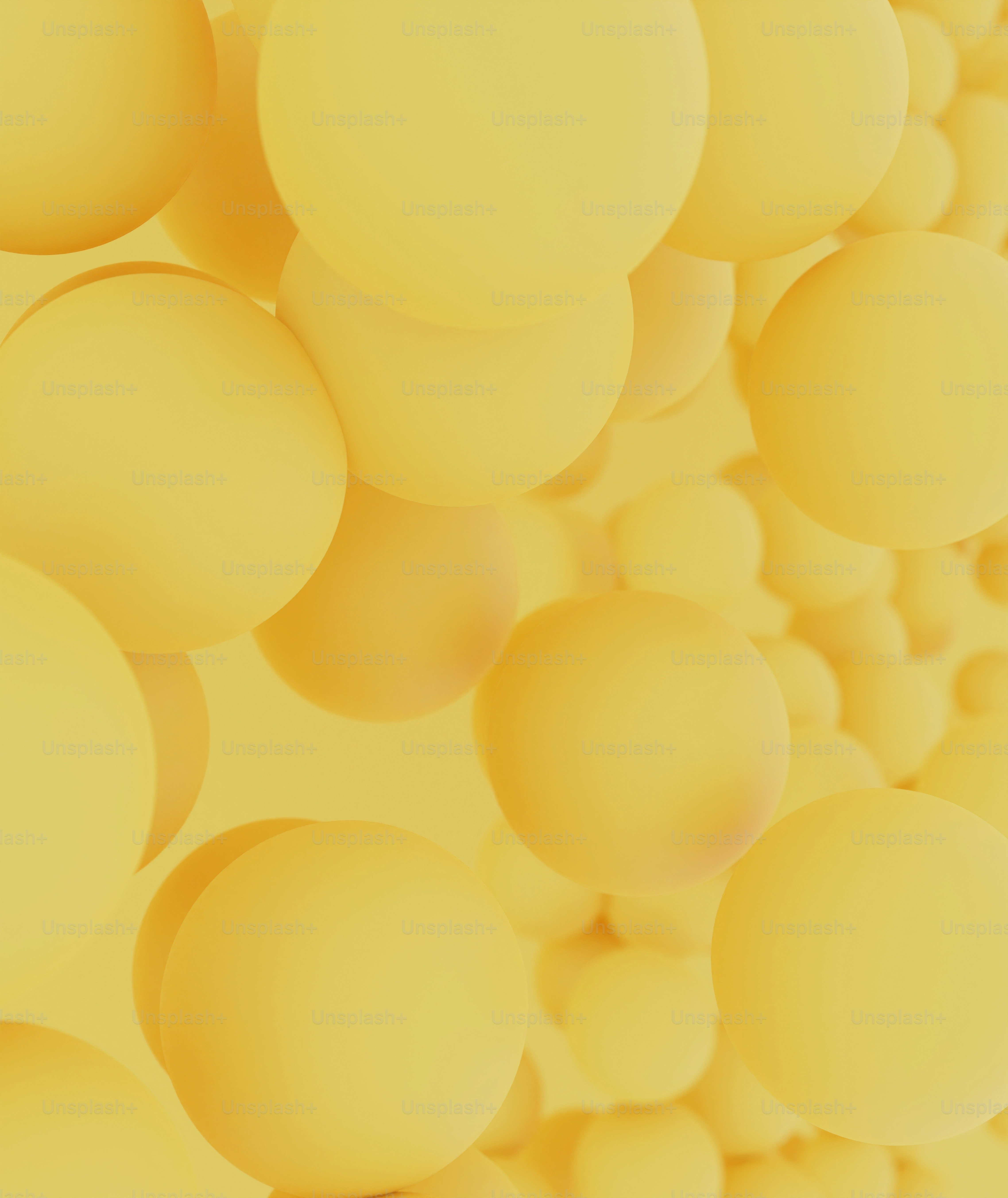 a bunch of yellow balls floating in the air