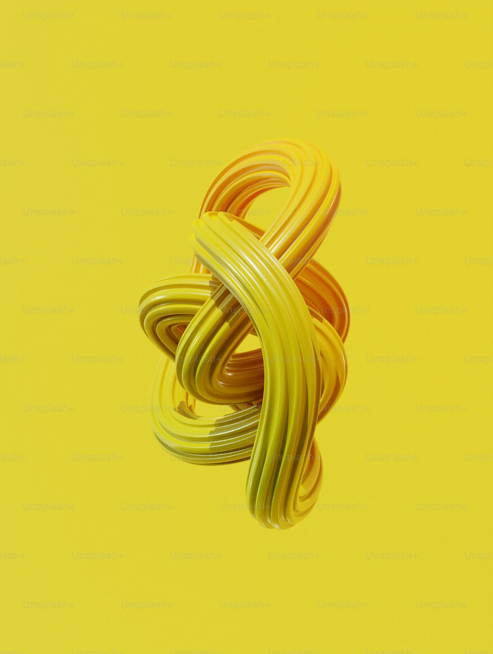 a yellow and green object on a yellow background