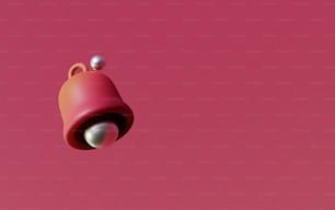 ein rosafarbenes Objekt mit einer weißen Kugel darauf