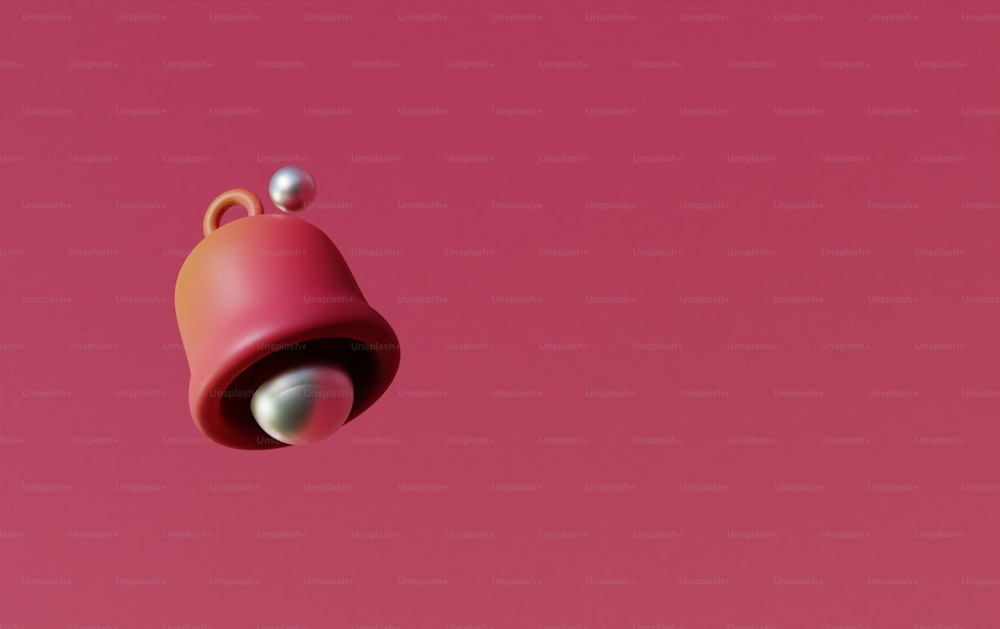 um objeto rosa com uma bola branca sobre ele