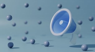 Un megafono blu e bianco circondato da palline
