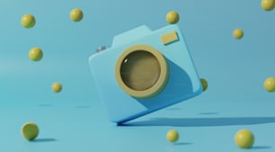 uma câmera azul cercada por bolas amarelas