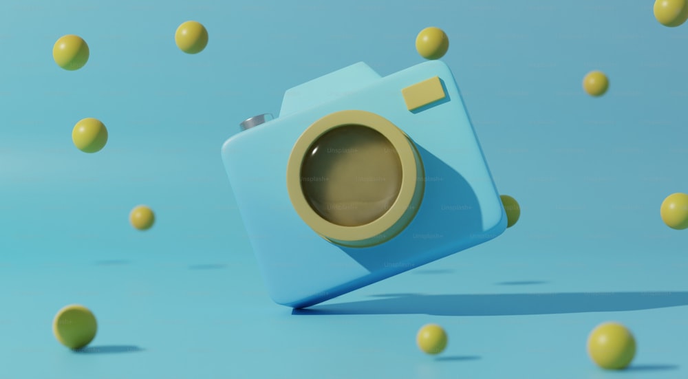 a blue camera surrounded by yellow balls