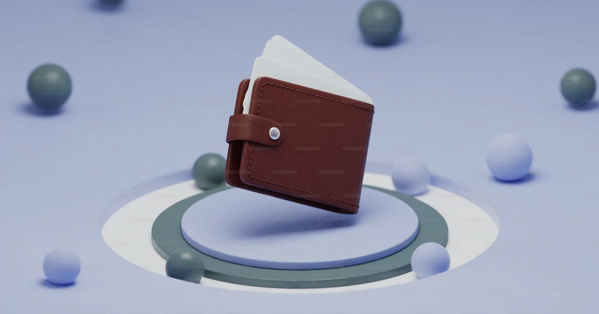 Wallet Thumbnail A small brown wallet sitting on top of a table photo – Wallet Image on ...