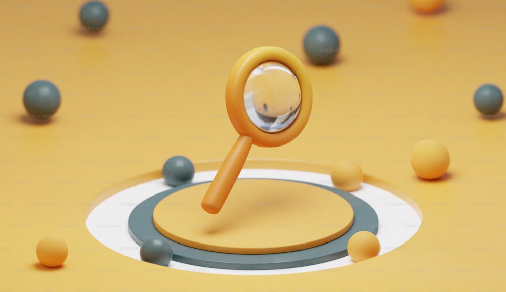 a magnifying glass sitting on top of a yellow surface