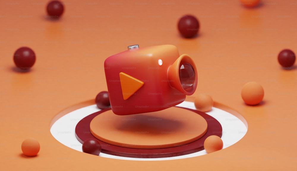 un objet rouge avec un objet orange au milieu