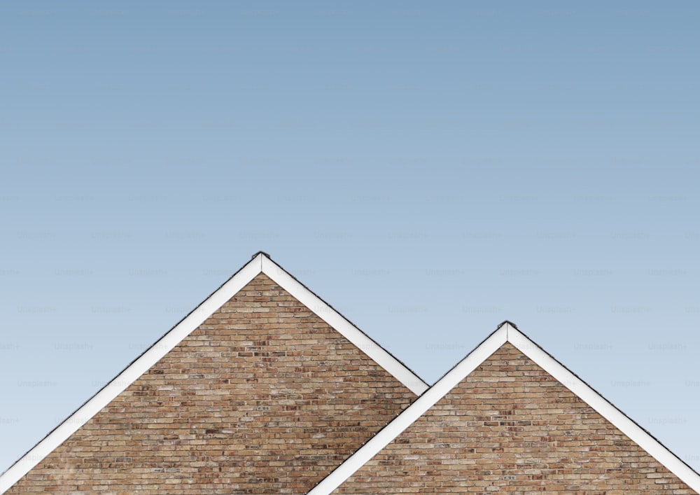 a brick building with a clock on the top of it