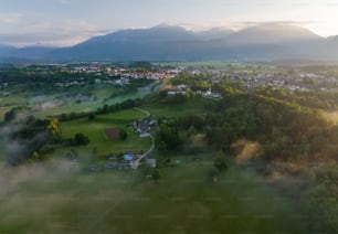 an aerial view of a town surrounded by mountains