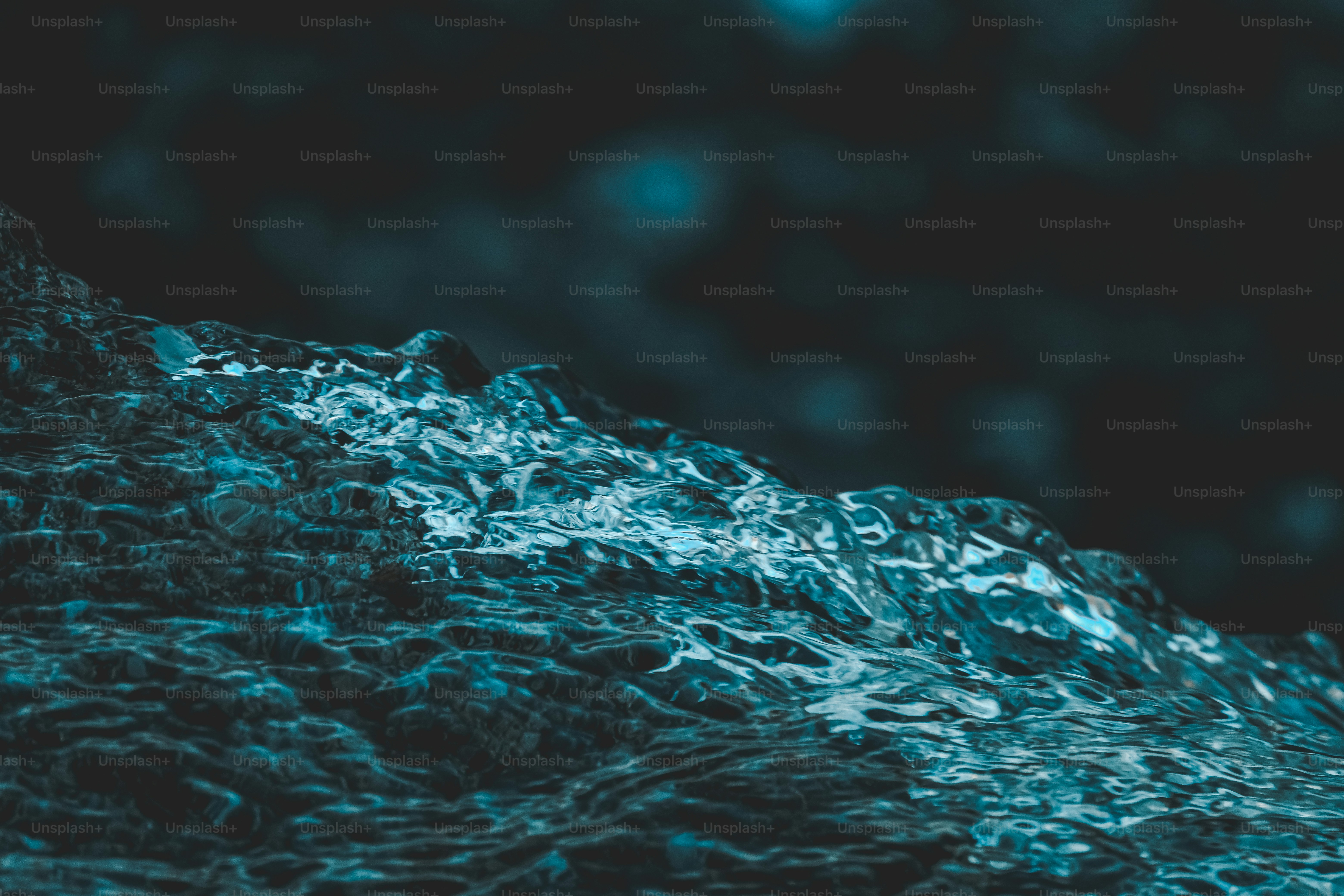 a close up of a mountain with water on it