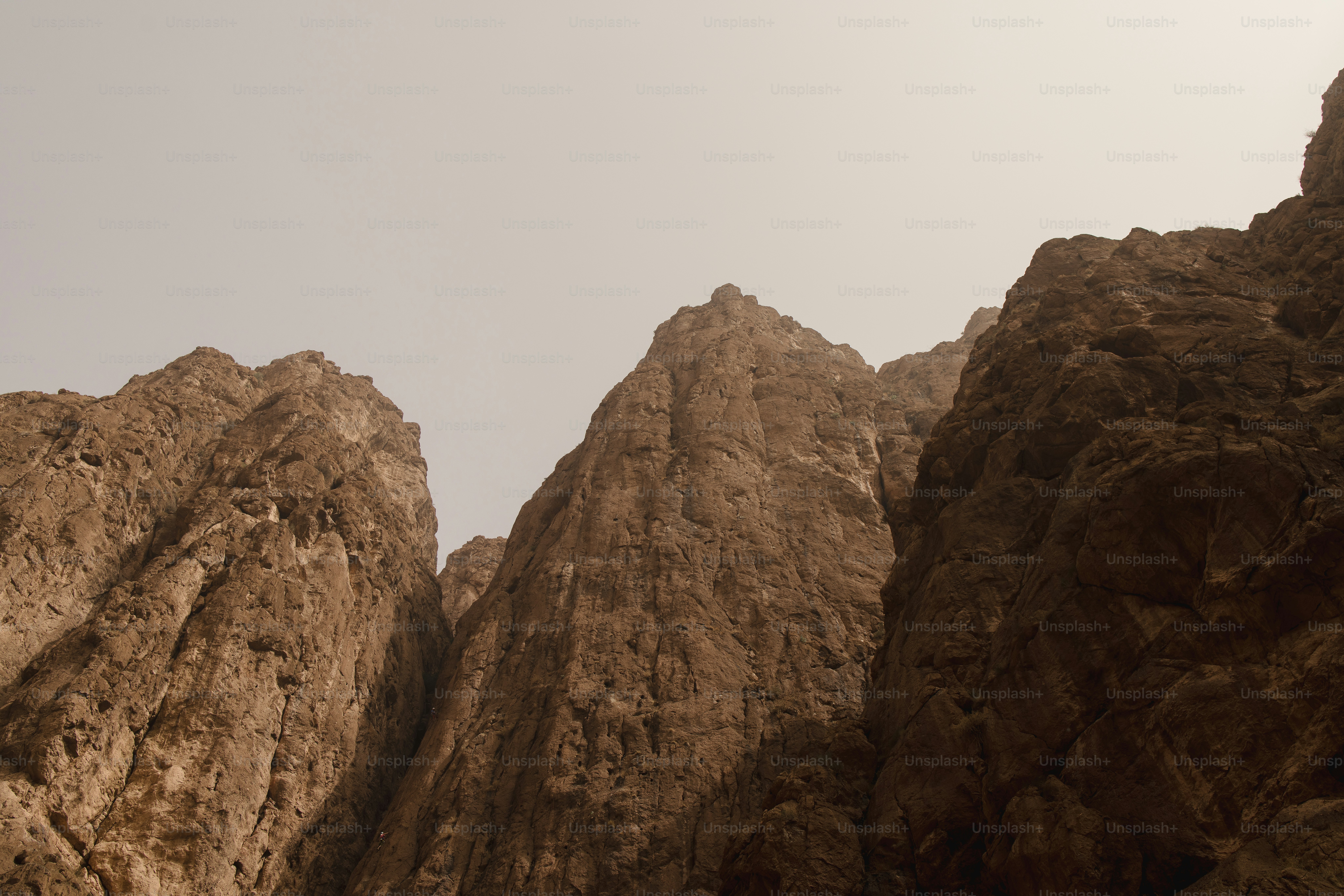 a group of mountains with a sky in the background
