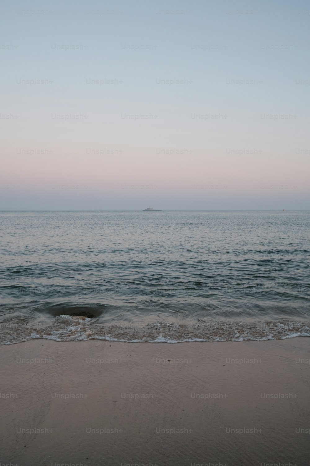 a view of a body of water from a beach