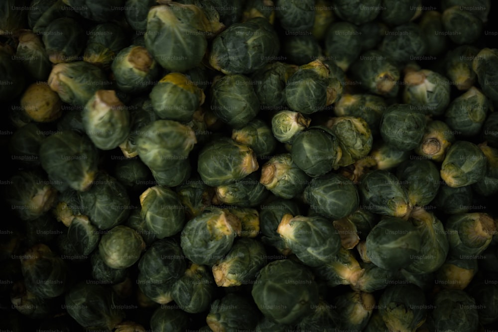 a pile of brussel sprouts sitting next to each other