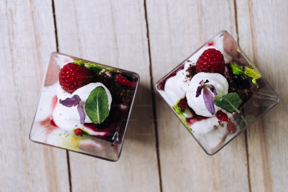 a couple of desserts sitting on top of a wooden table