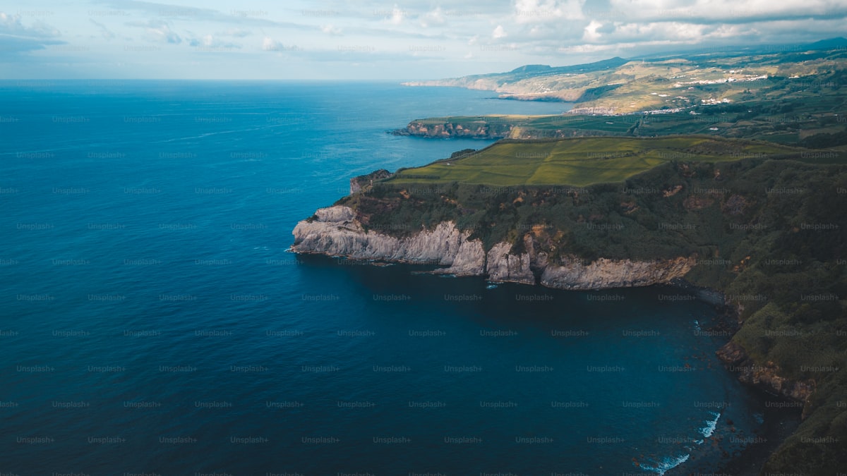 Lush green volcanic island rising from the Atlantic ocean