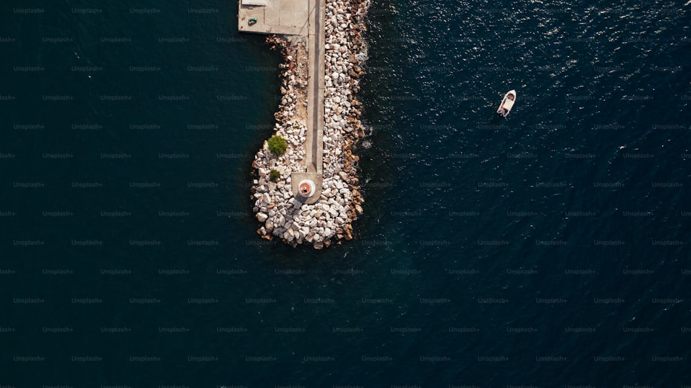 an aerial view of a pier on the water