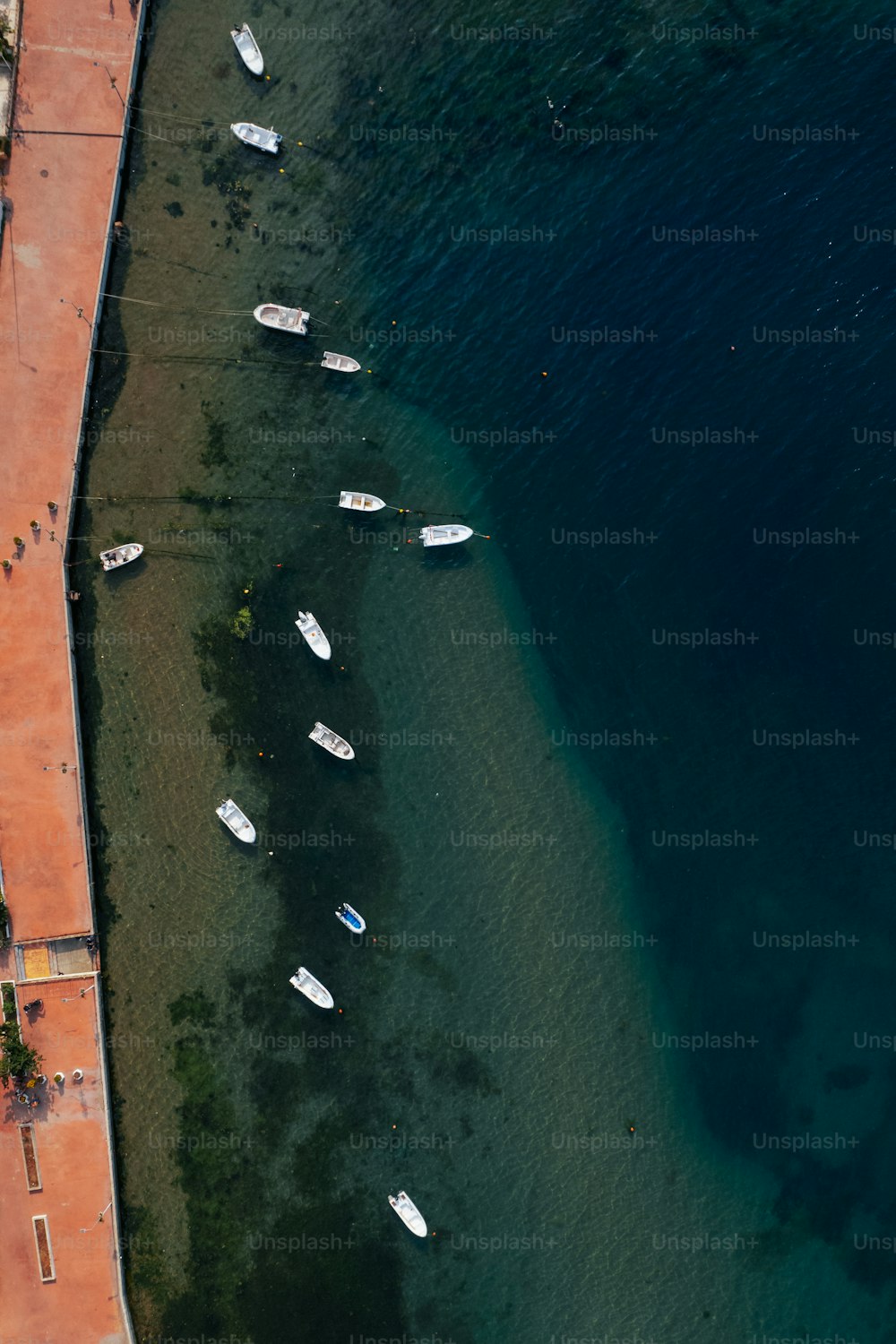 a group of boats sitting on top of a body of water