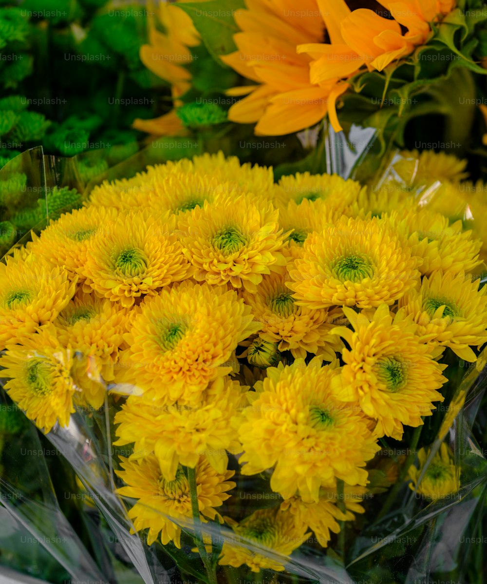 a bunch of yellow flowers in a bouquet