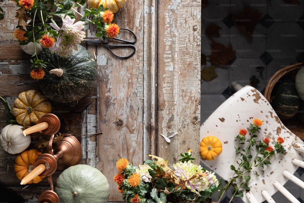 a table topped with lots of different types of flowers