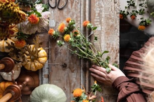 a woman is arranging flowers on a door
