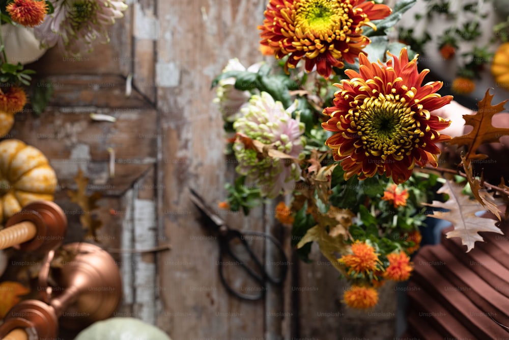 a bunch of flowers hanging from a wooden door