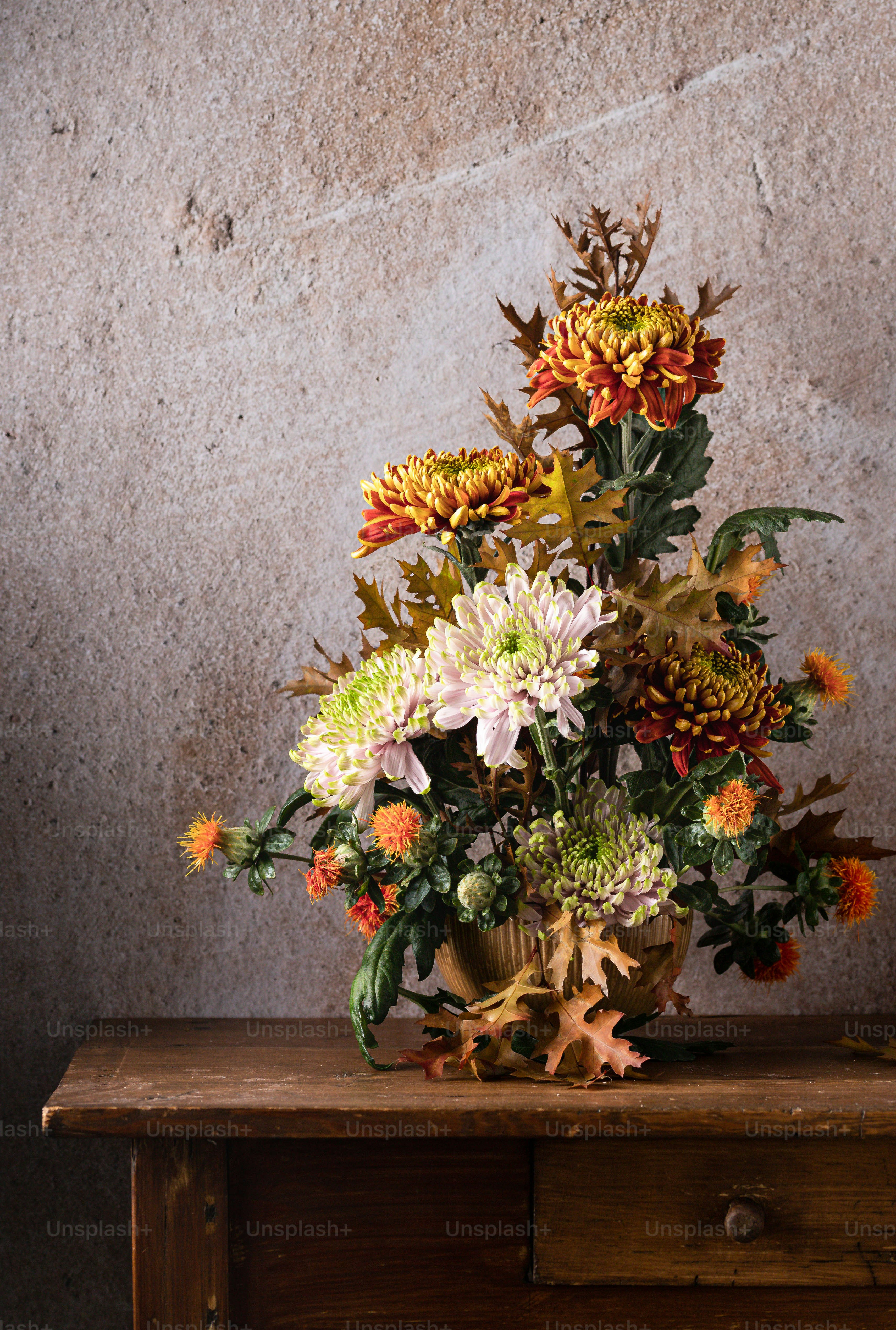 a bouquet of flowers sitting on top of a wooden table