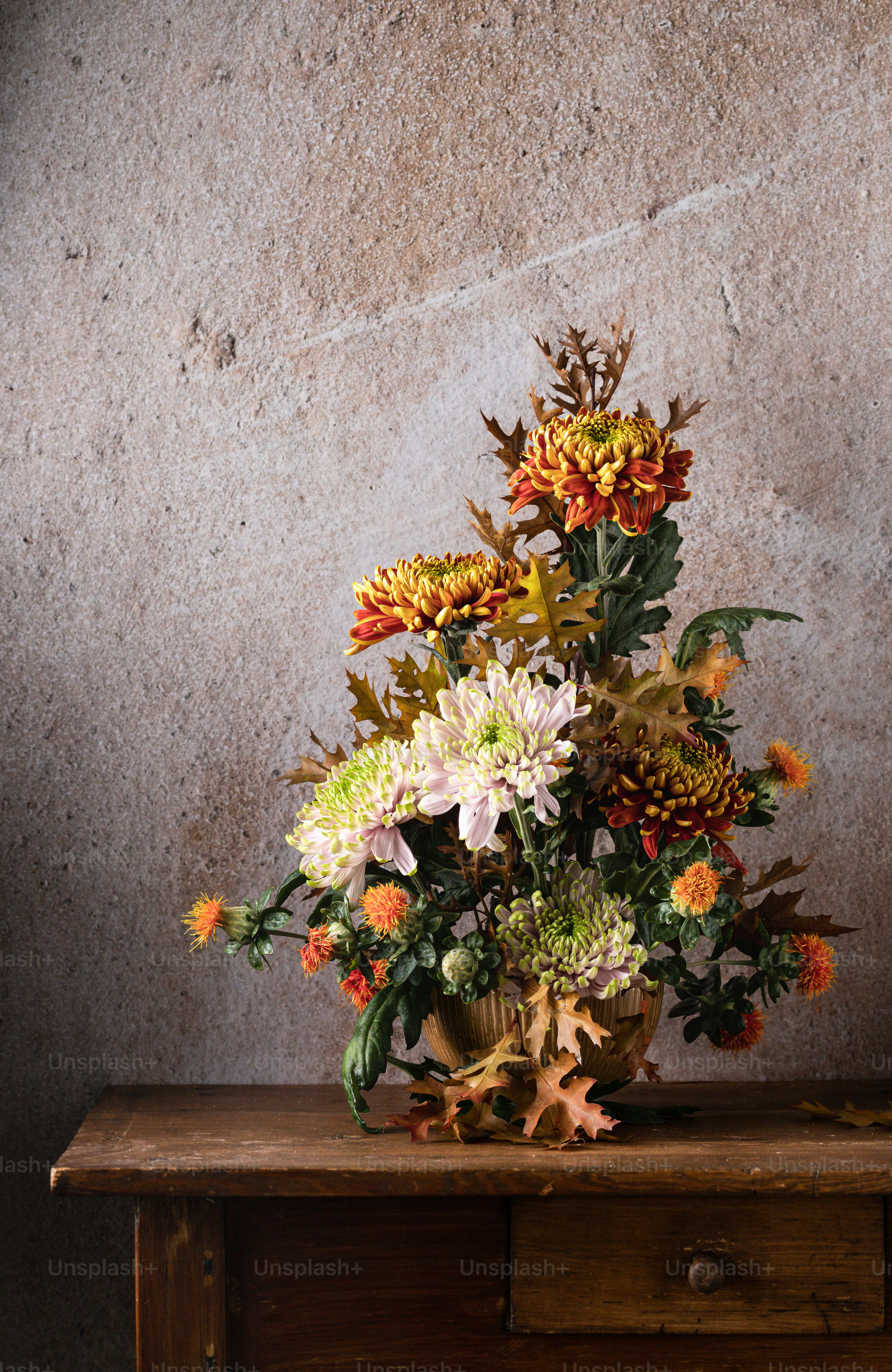 a bouquet of flowers sitting on top of a wooden table