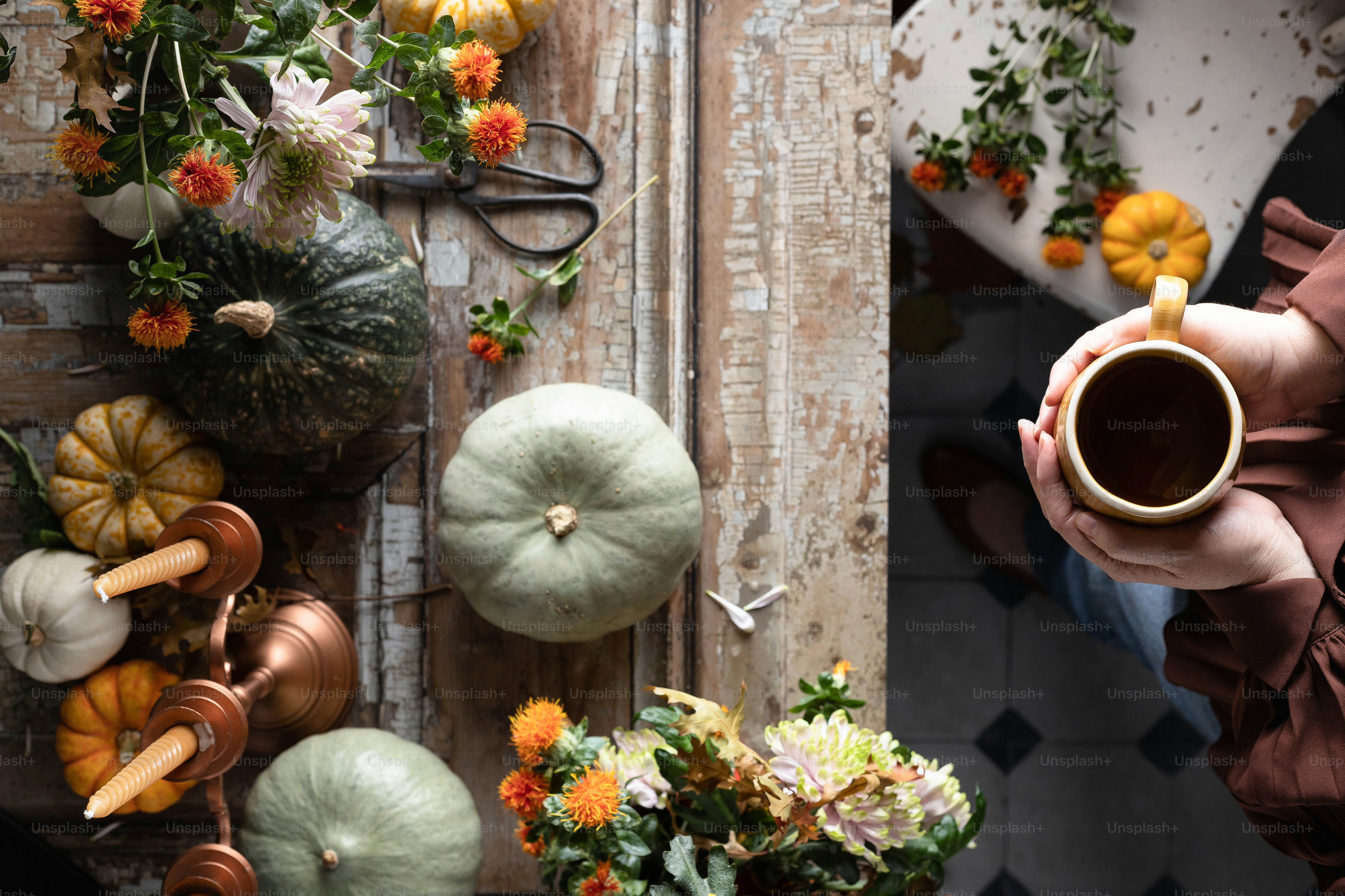 a person holding a cup of coffee in their hands