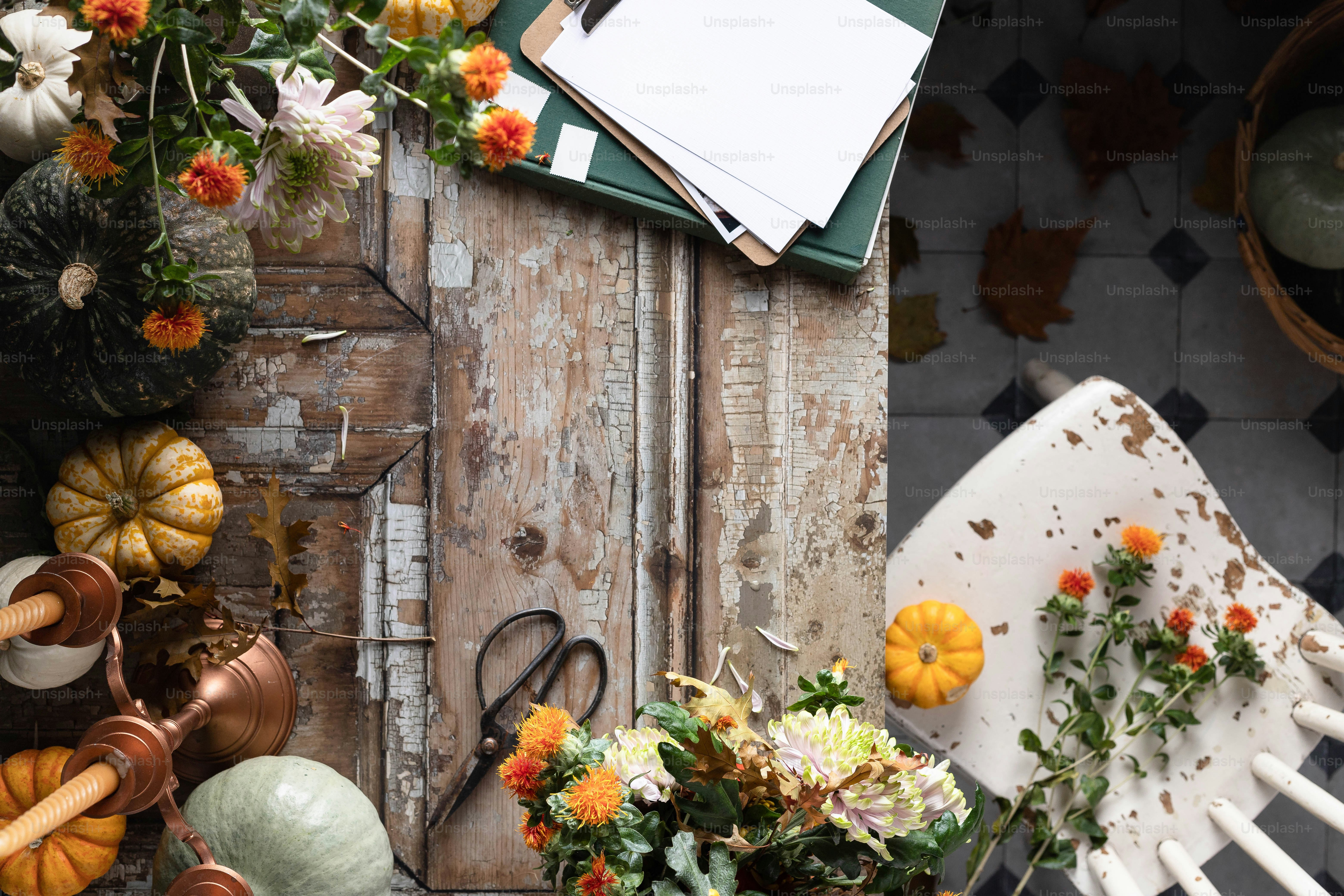 a table topped with lots of different types of flowers