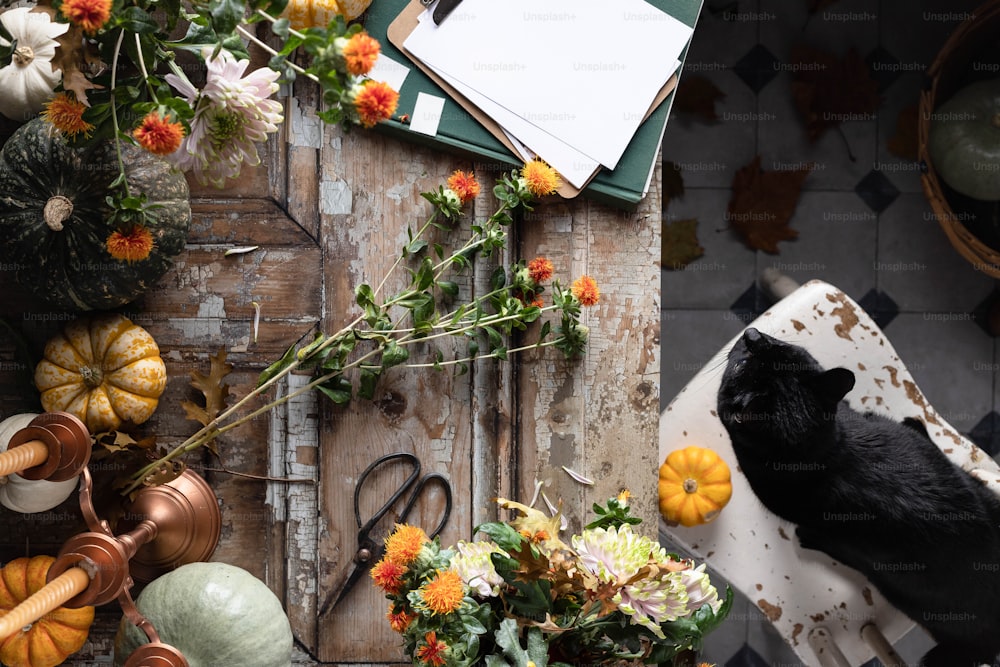 a table topped with lots of different types of flowers