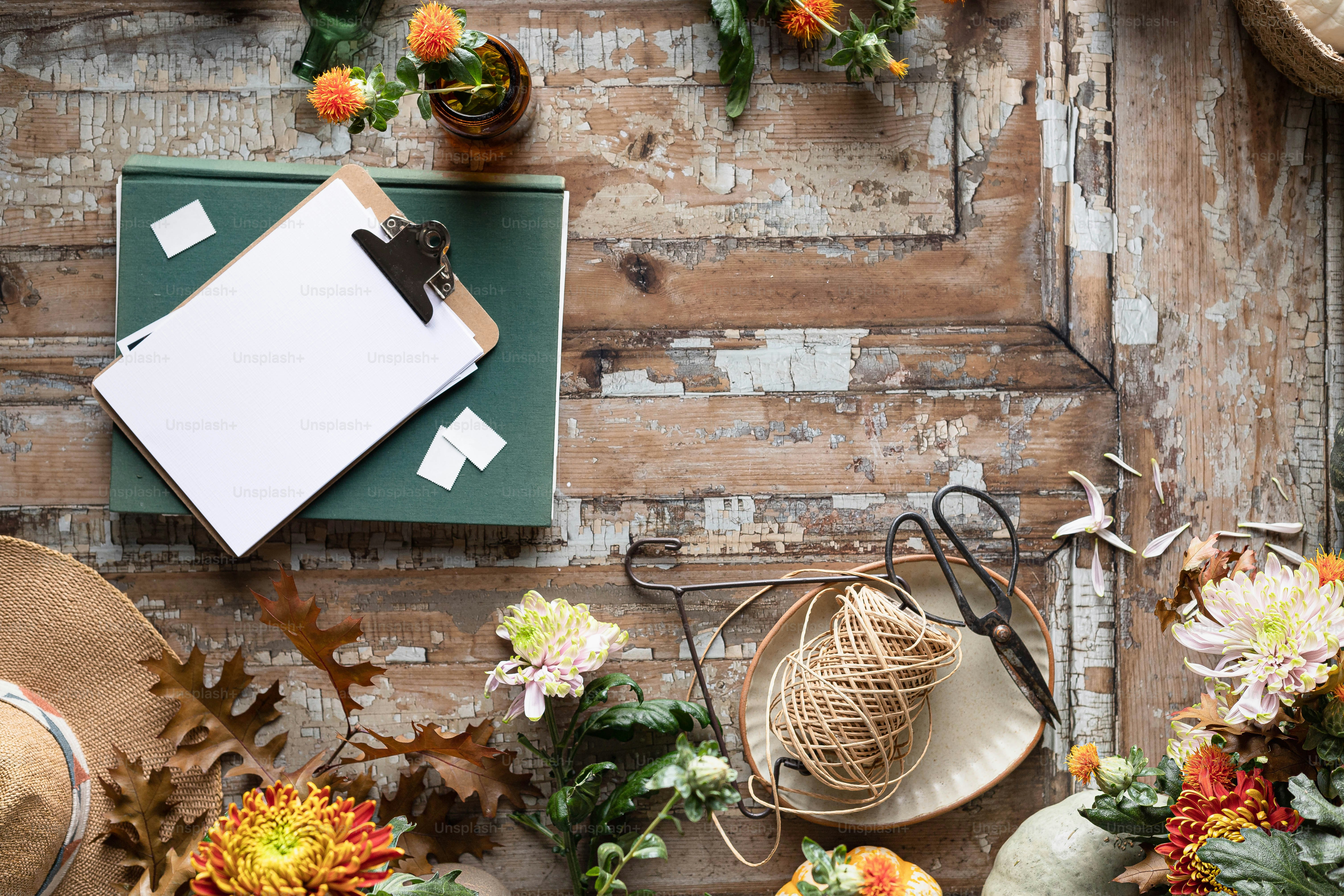 a table topped with lots of different types of flowers