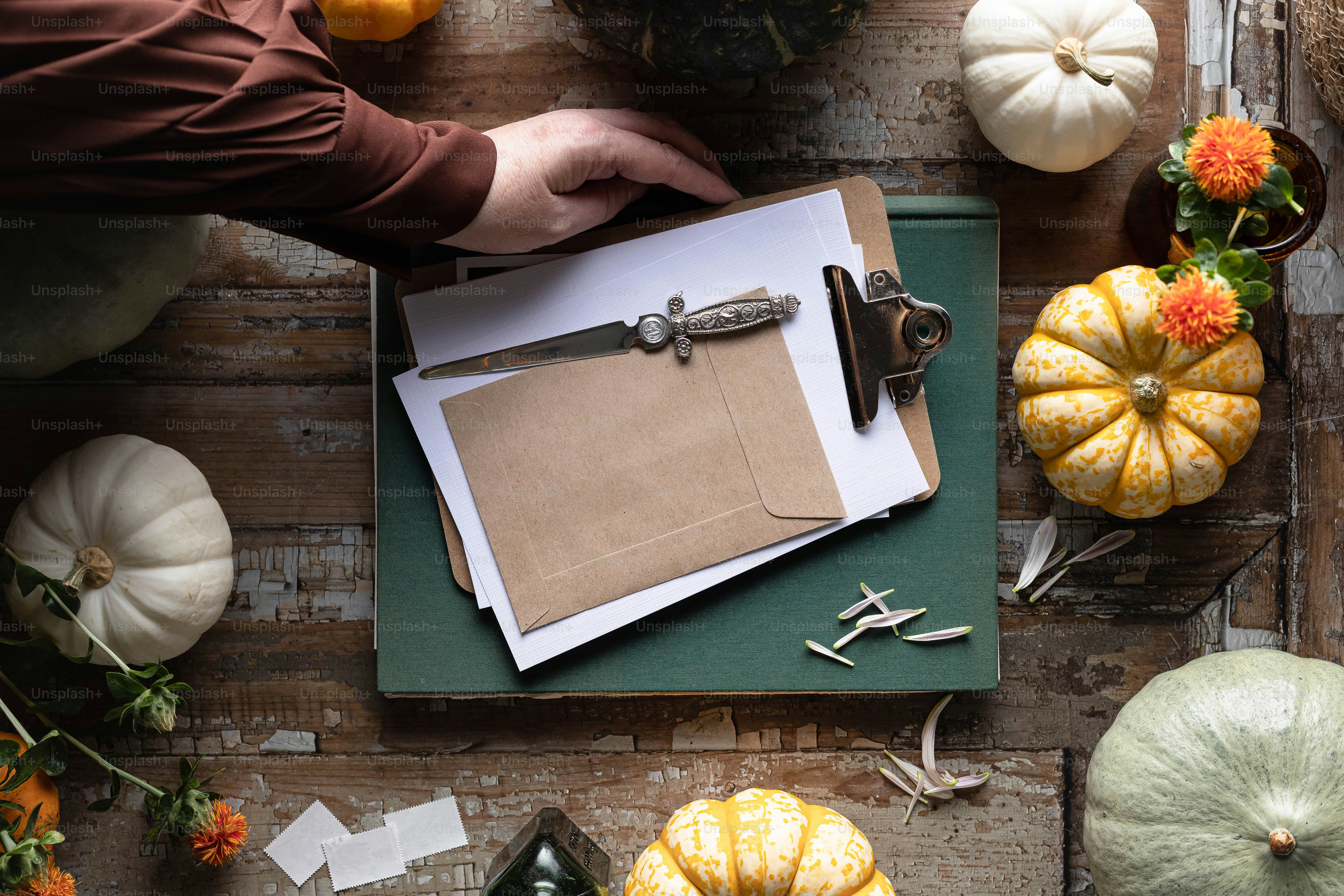 a person cutting a piece of paper with a pair of scissors