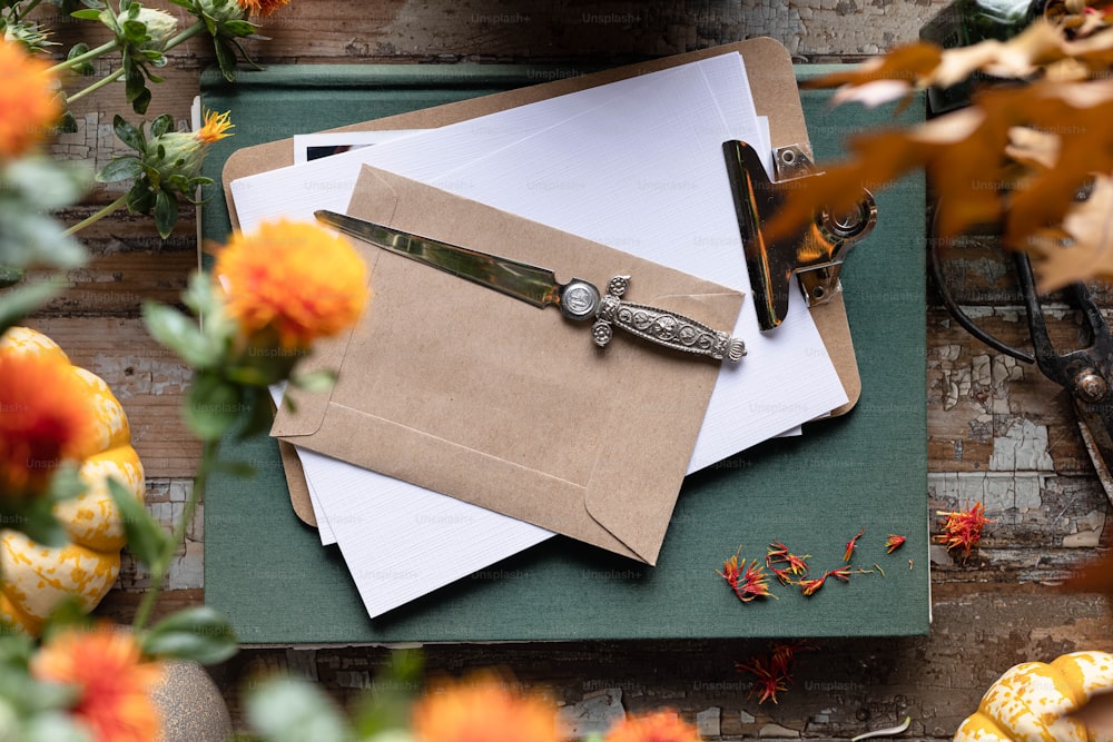 a pair of scissors sitting on top of a piece of paper