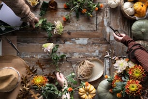 a table topped with lots of different types of flowers