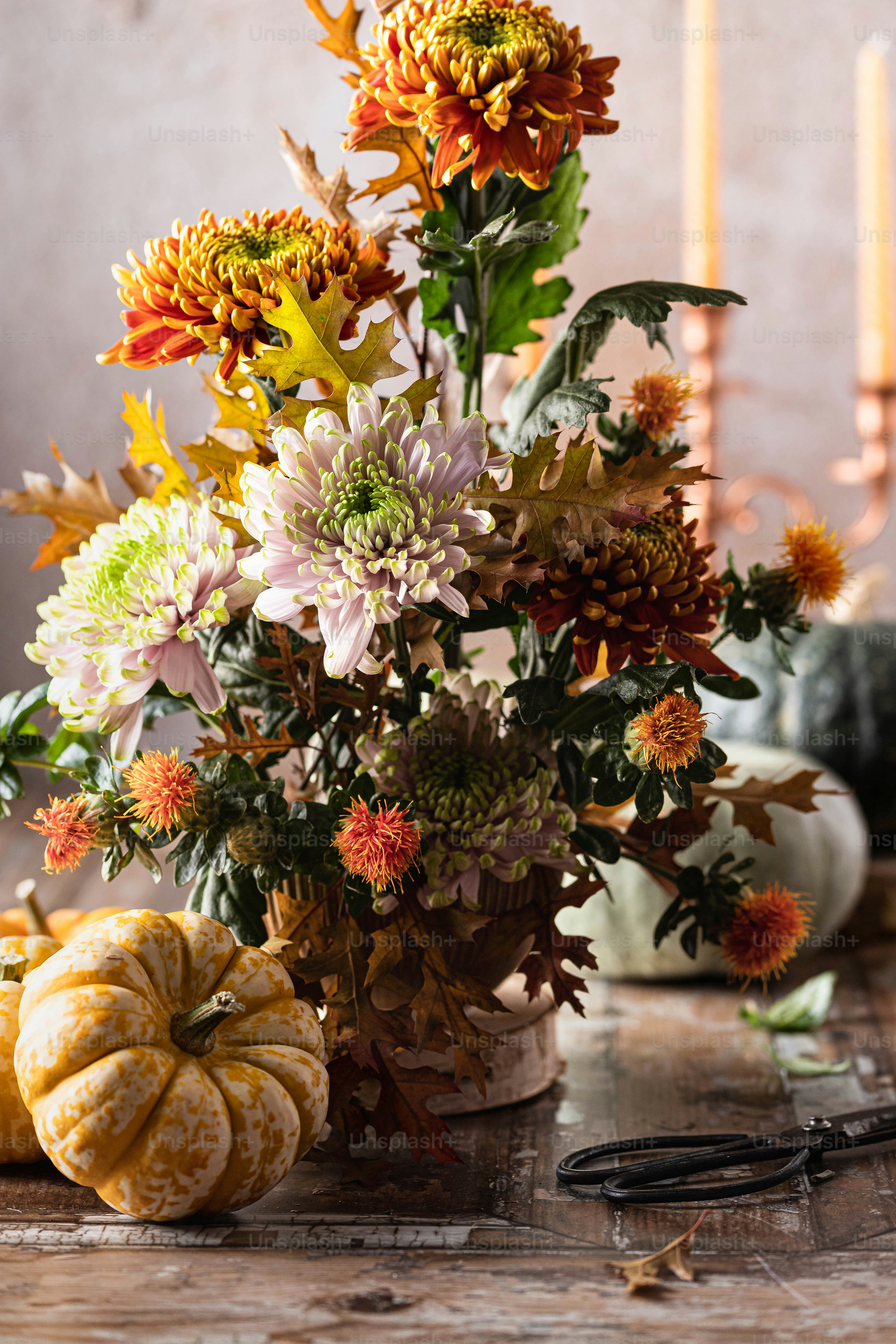 A vase filled with lots of flowers on top of a table photo – Flowers ...
