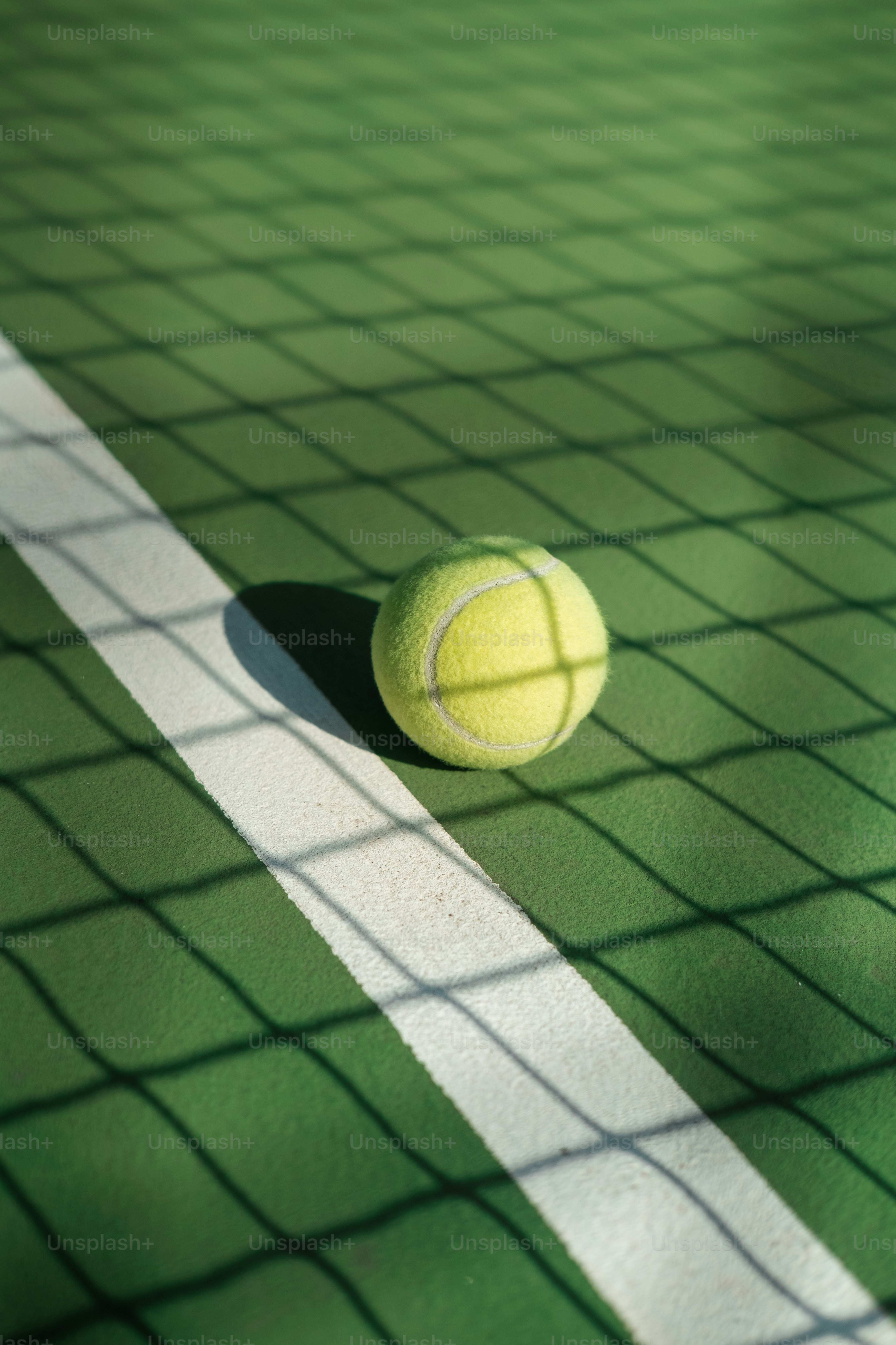 a tennis ball sitting on a tennis court