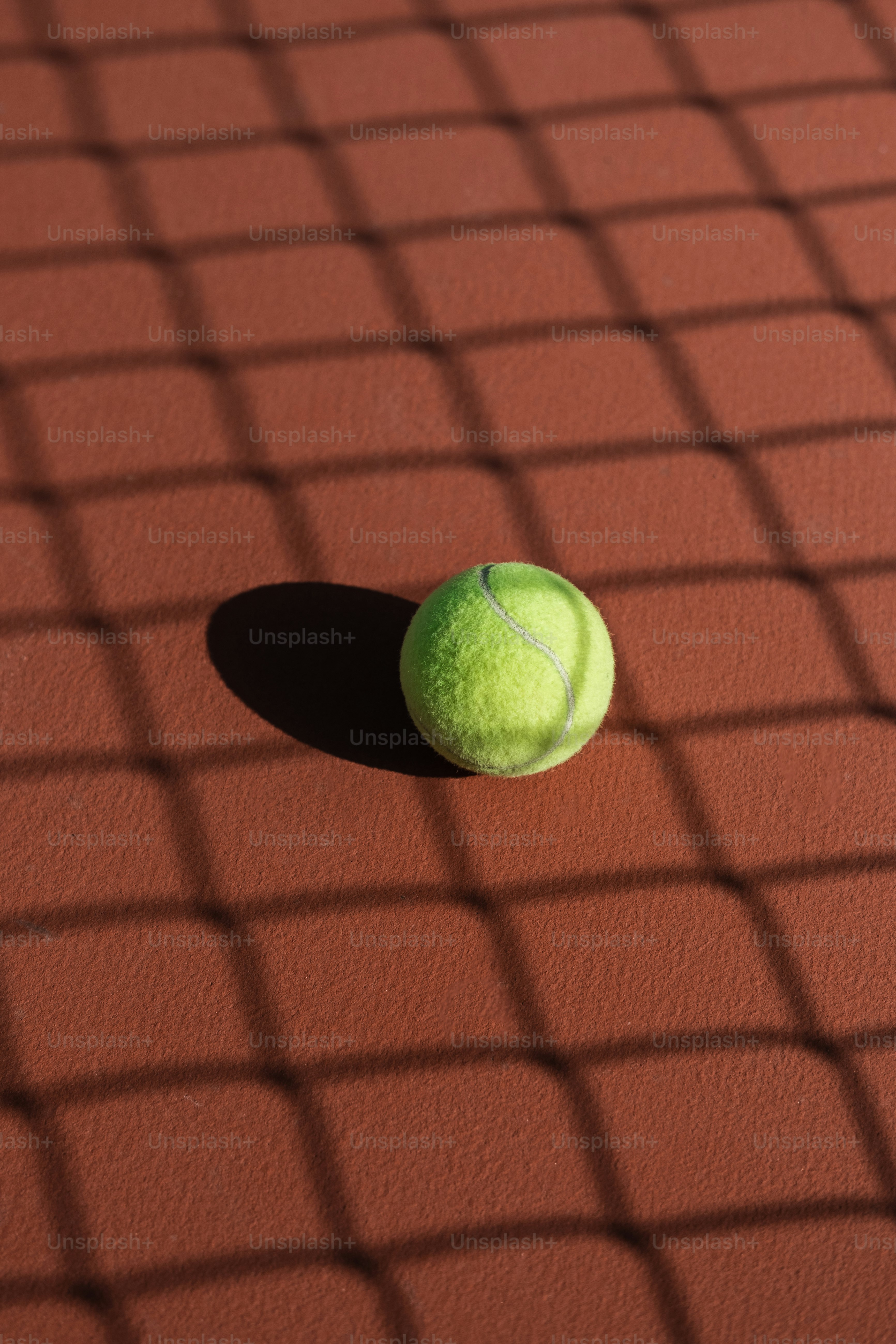 a tennis ball sitting on a tennis court