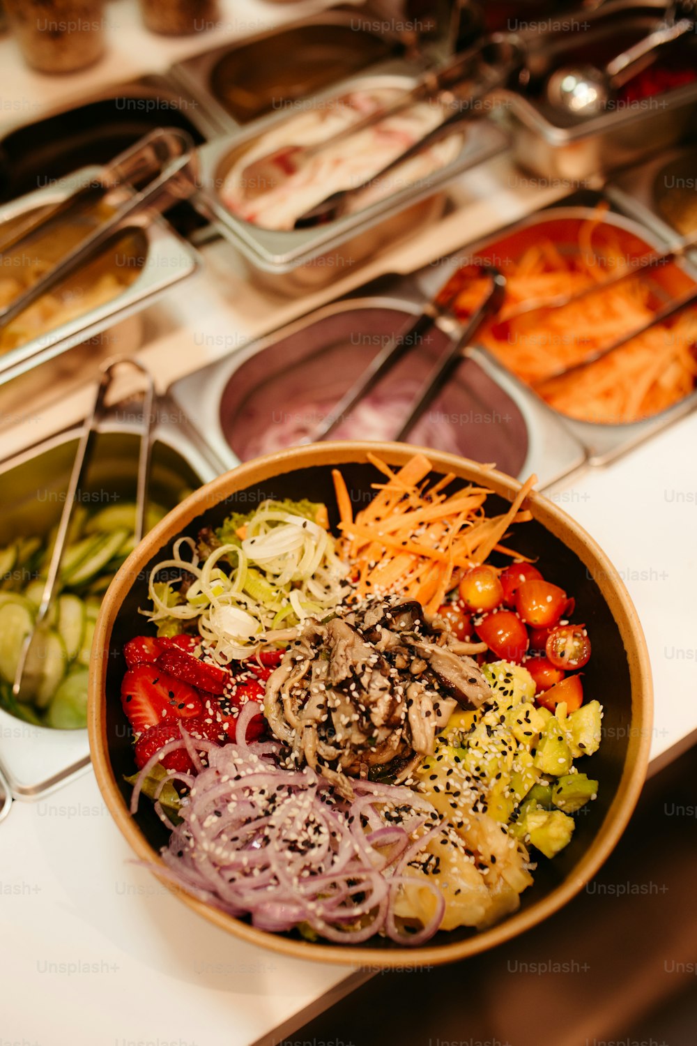 a bowl of salad with a variety of toppings