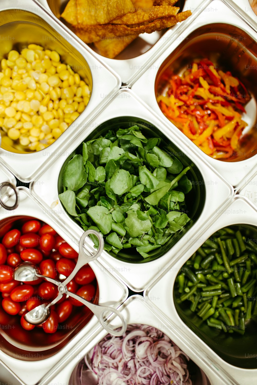 a variety of vegetables are arranged in a griddle