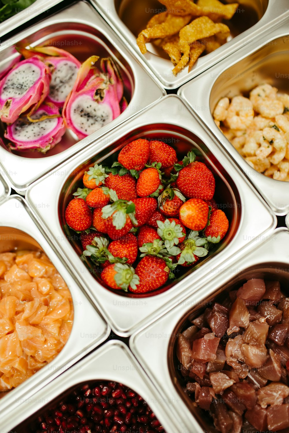 a close up of a tray of food with fruits and vegetables