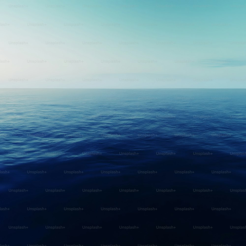 a large body of water with a sky background