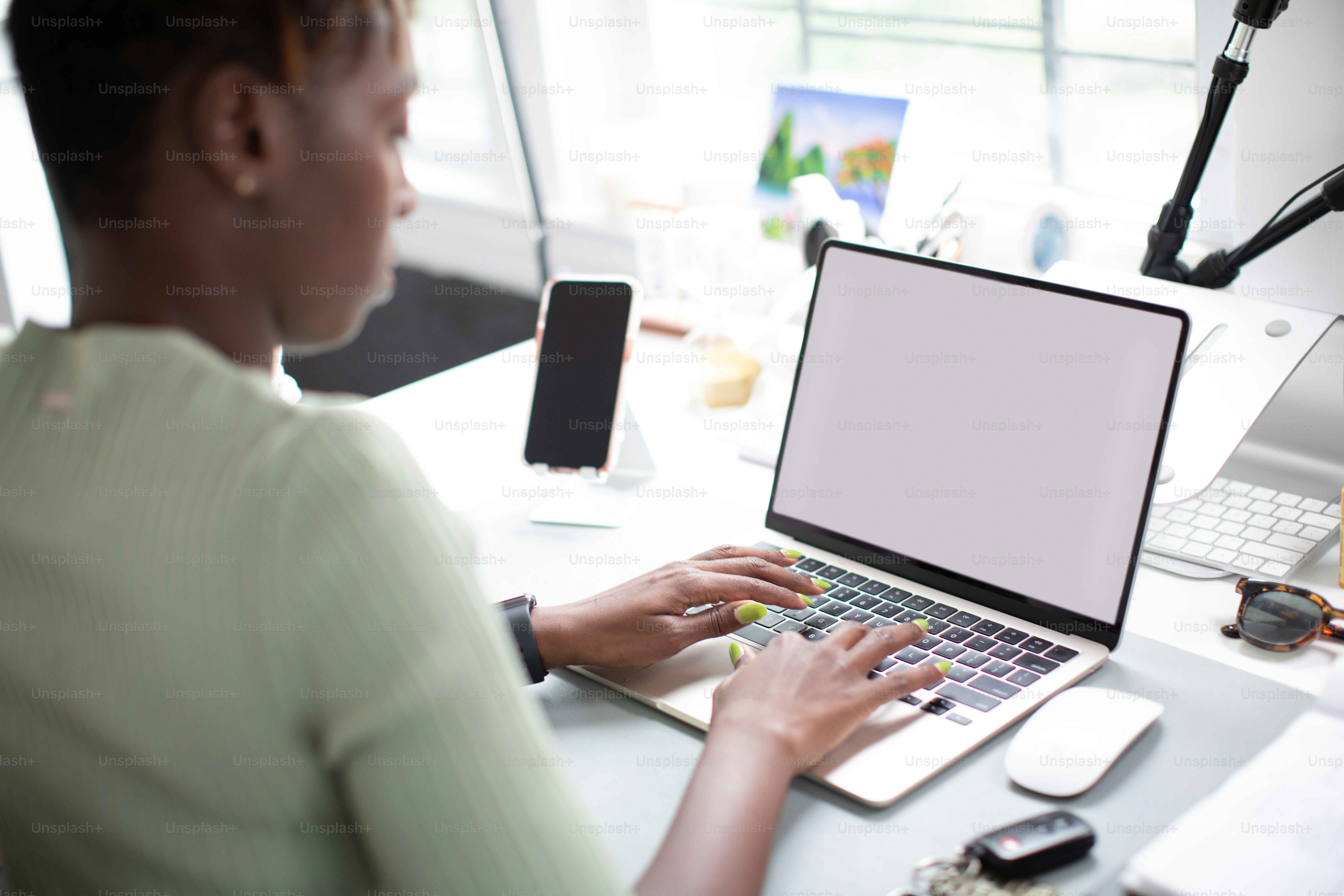 A person using a laptop computer on a wooden table photo – Computer ...