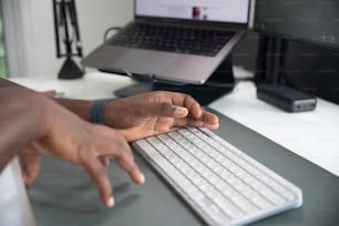 a person is typing on a computer keyboard