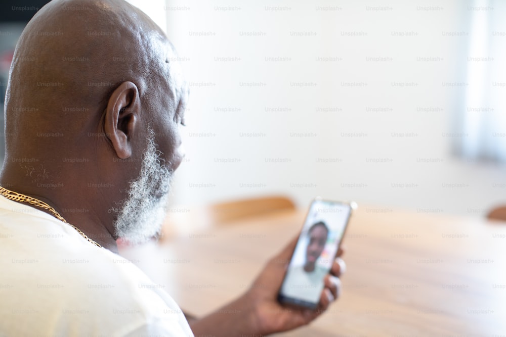 a man holding a cell phone with a picture on it