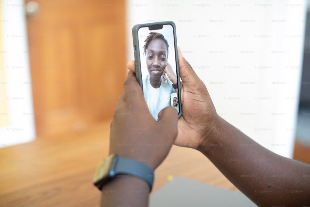 a woman taking a picture of herself on her phone