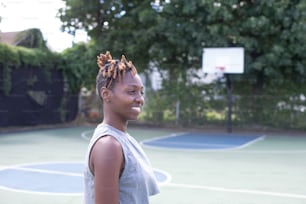 a woman standing on a tennis court holding a tennis racquet