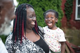 a woman and a child are laughing together