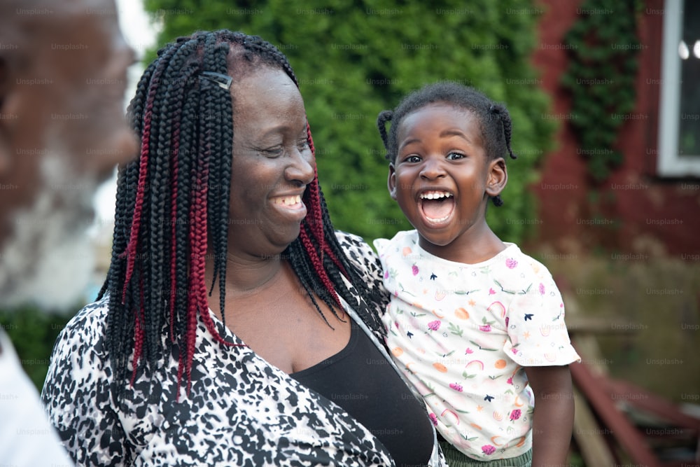 a woman and a child are laughing together