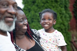 a woman and a child are smiling for the camera