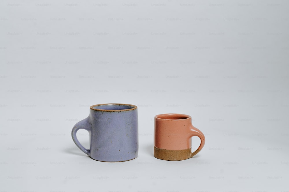 a couple of mugs sitting next to each other